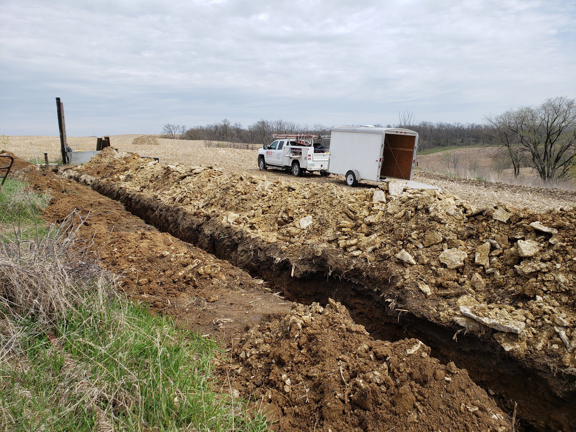 Mracek Truck with trench next to it.